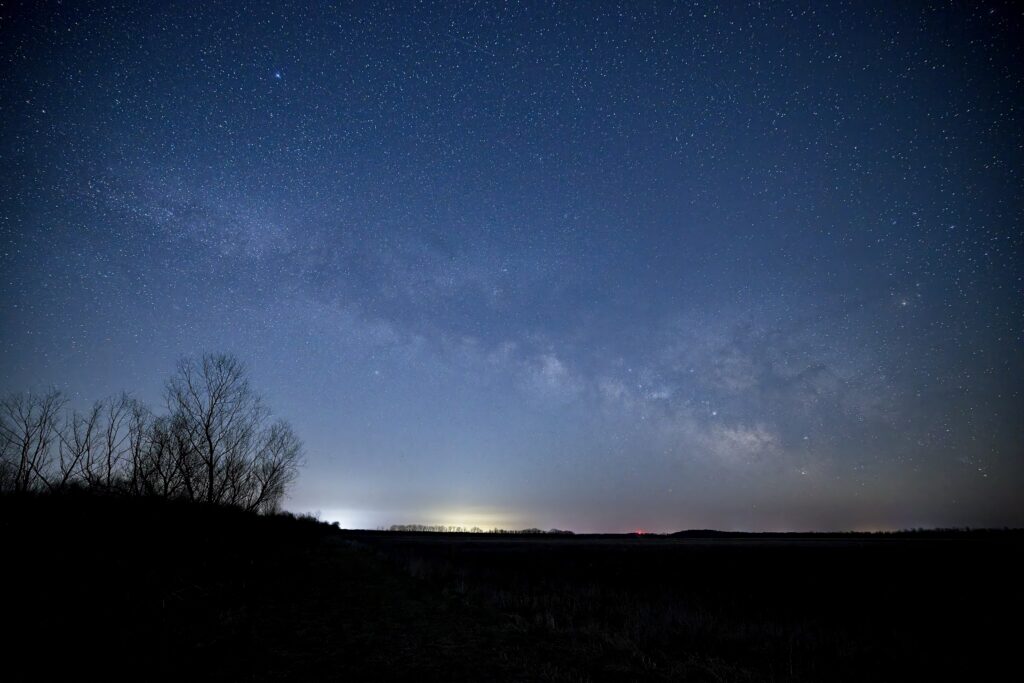 The Milky Way appears just above the horizon.